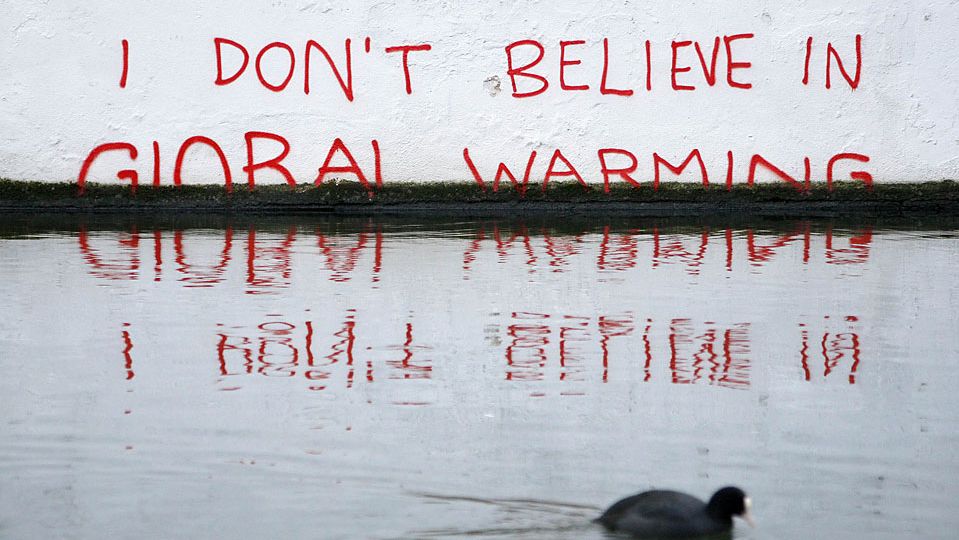 Graffiti art is seen on a wall next to the Regent's Canal in Camden in London